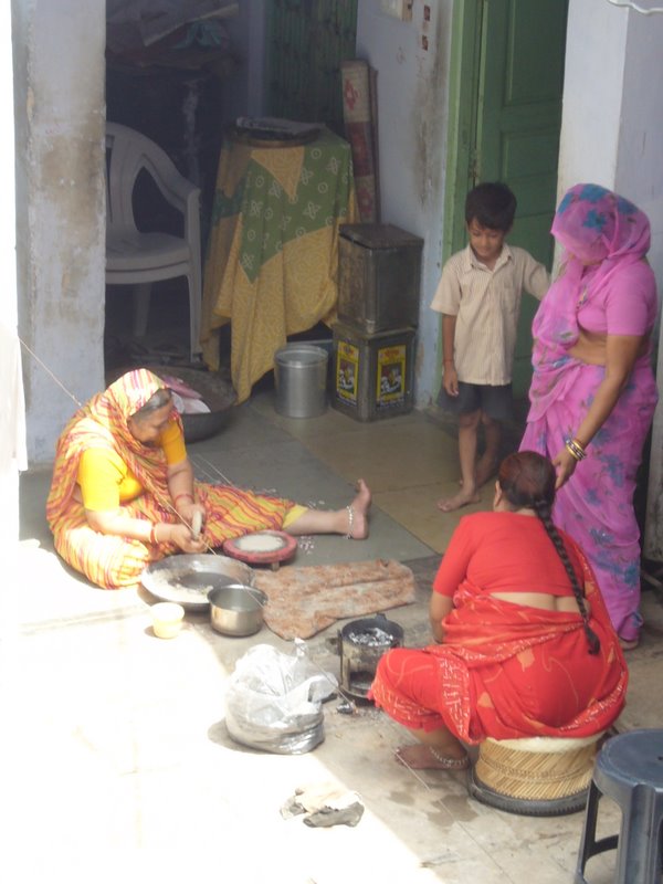 The neighbours are making chapatis.